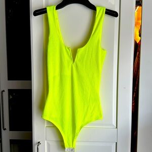 Never worn neon yellow body suit